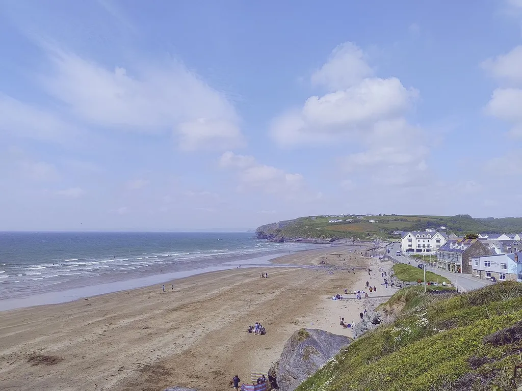 Wide sandy family beach at Broad Haven with rockpools and cliffs